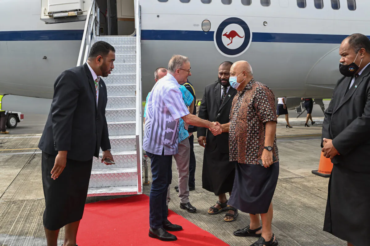 Australian Prime Minister Anthony Albanese is greeted by Fiji Special Envoy to the Pacific Ratu Inoke Kubuobola as he arrives at Nausori Airport for the Pacific Islands Forum leaders summit in Suva, Fiji,  Wednesday, July 13, 2022 (AAP Image/Pool, The Age, Joe Armao) NO ARCHIVING