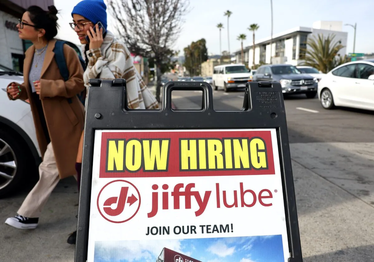 A ‘Now Hiring’ sign is displayed outside a Jiffy Lube location in Los Angeles, Calif., on Feb. 2, 2023. (Photo by Mario Tama/Getty Images)