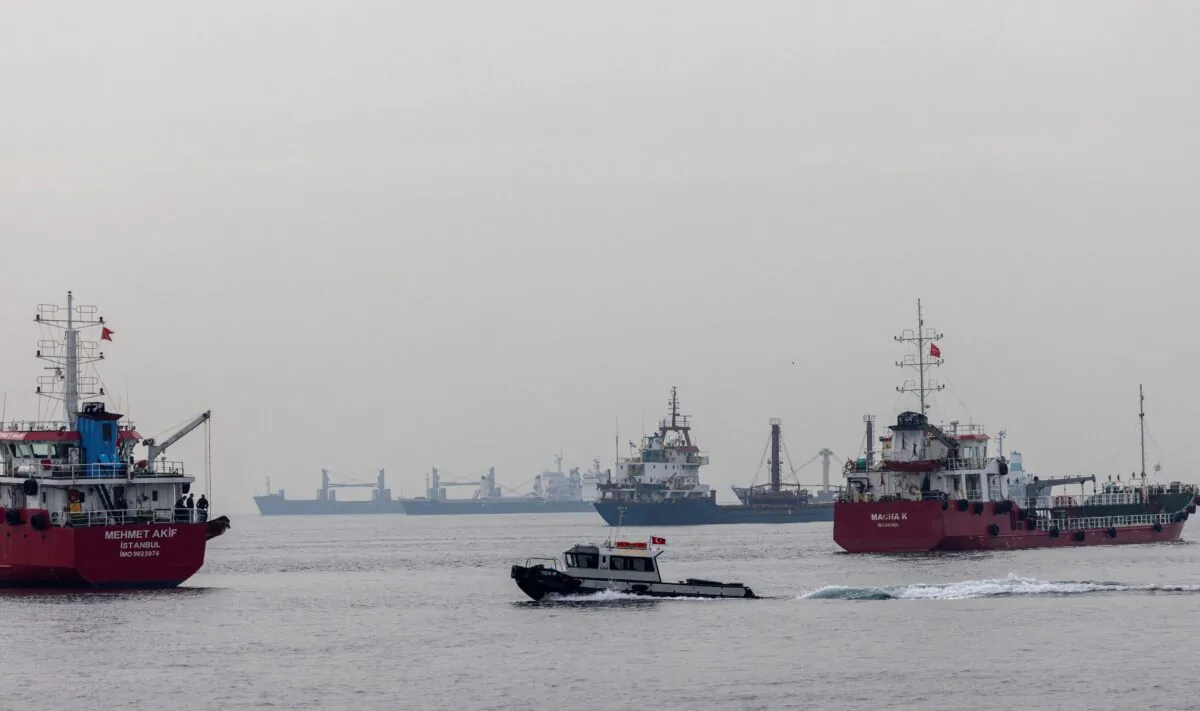 Commercial vessels including vessels that are part of Black Sea grain deal wait to pass the Bosphorus strait off the shores of Yenikapi during a misty morning in Istanbul on Oct. 31, 2022. (Umit Bektas/Reuters)