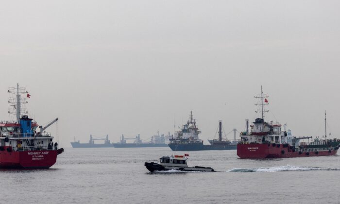 Commercial vessels including vessels that are part of Black Sea grain deal wait to pass the Bosphorus strait off the shores of Yenikapi during a misty morning in Istanbul, Turkey, on Oct. 31, 2022. (Umit Bektas/File Photo/Reuters)