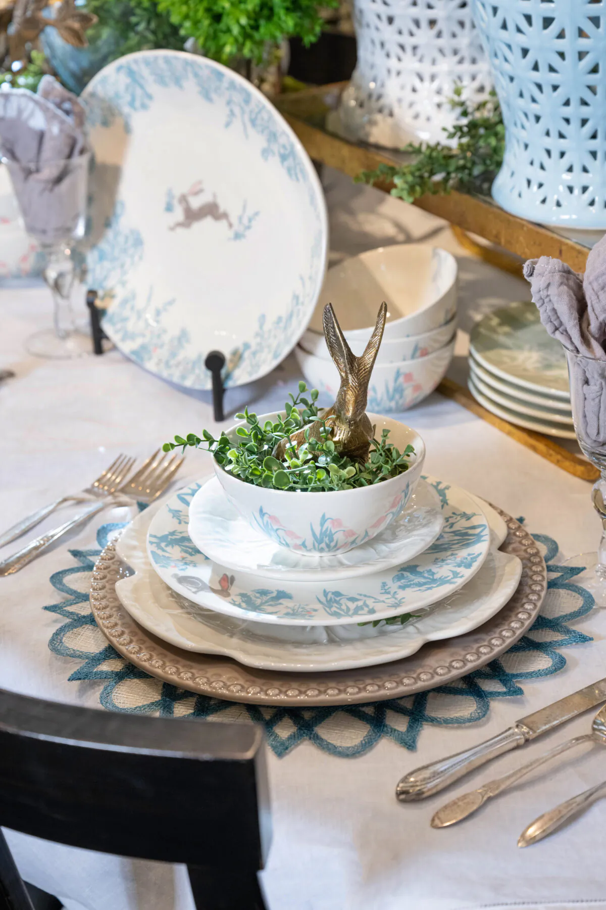 At this table, ginger jars, statement bunnies and greenery fill the center of the table, with bunny dishes nestled among them. (Handout/TNS)