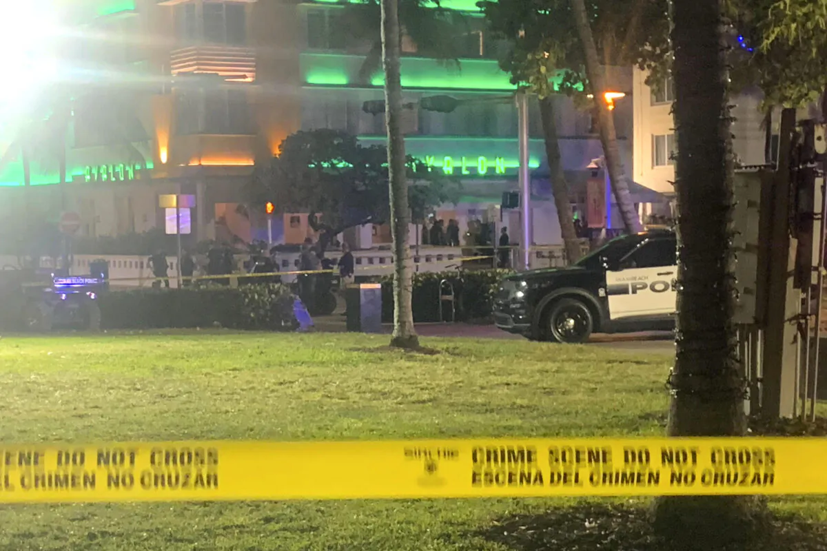 Crime scene tape is shown at the scene along Ocean Drive in Miami Beach, Fla., on March 17, 2023. (Aaron Leibowitz/Miami Herald via AP)