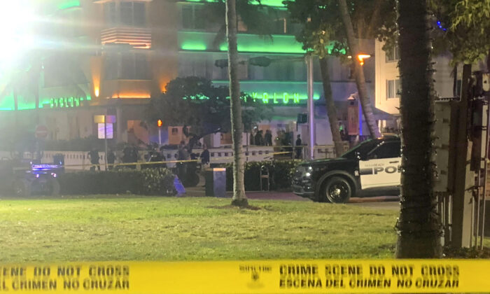 Crime scene tape is shown at the scene along Ocean Drive in Miami Beach, Fla., on March 17, 2023. (Aaron Leibowitz/Miami Herald via AP)