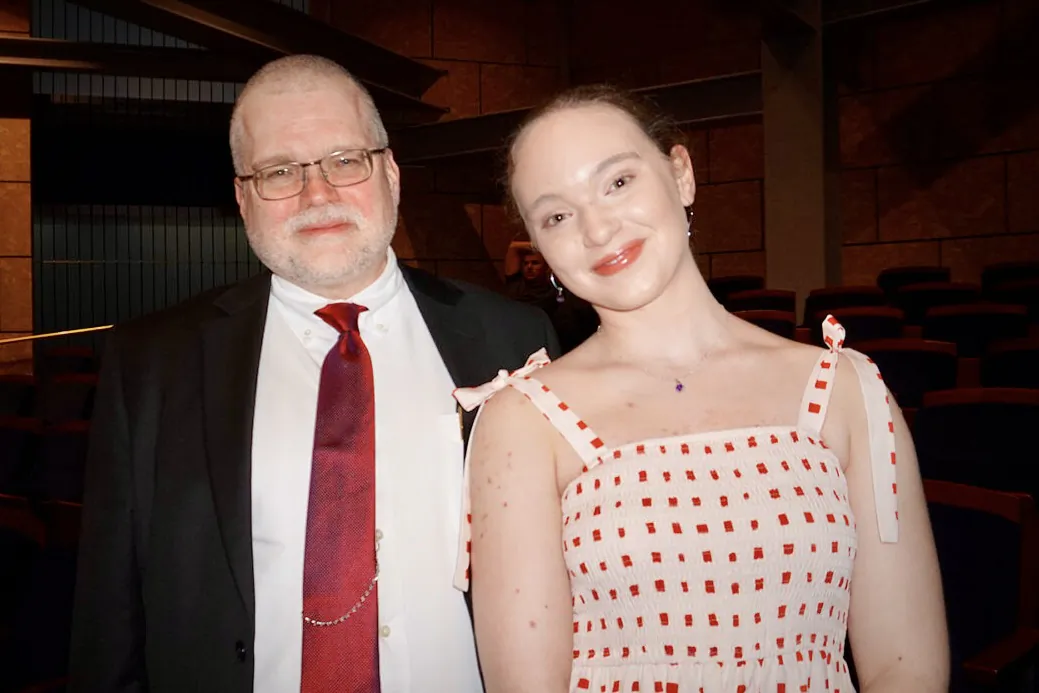 Letitia Prosser, an aspiring ballet dancer, attended Shen Yun Performing Arts with her father Bill Prosser at Dr. Phillips Center for the Performing Arts, in Orlando, Fla., on March 17, 2023. (Sally Sun/The Epoch Times)