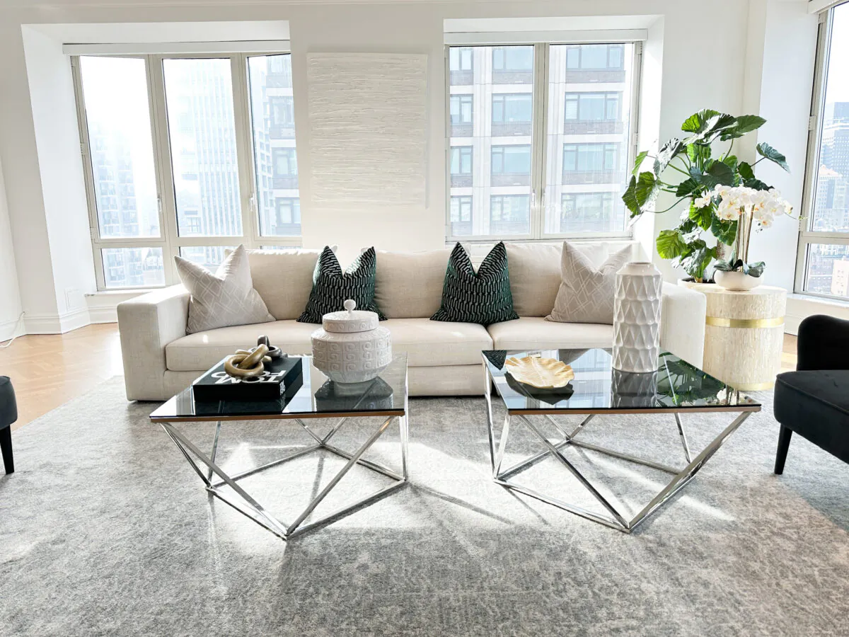 Elements of black, white and gold are repeated throughout this living room to create a sense of cohesion. (Provided photo/TNS)