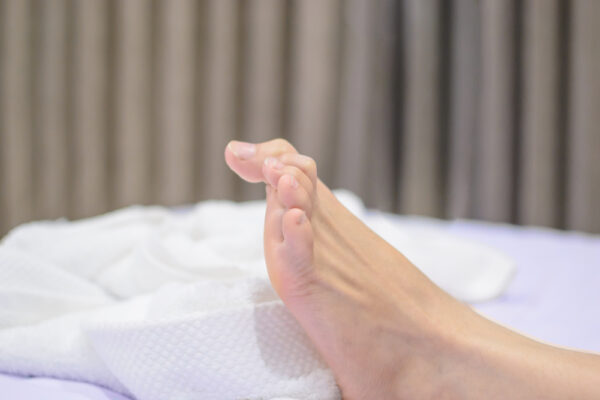 Sudden leg cramps at night may indicate calcium deficiency. (Ai2myyy/Shutterstock)