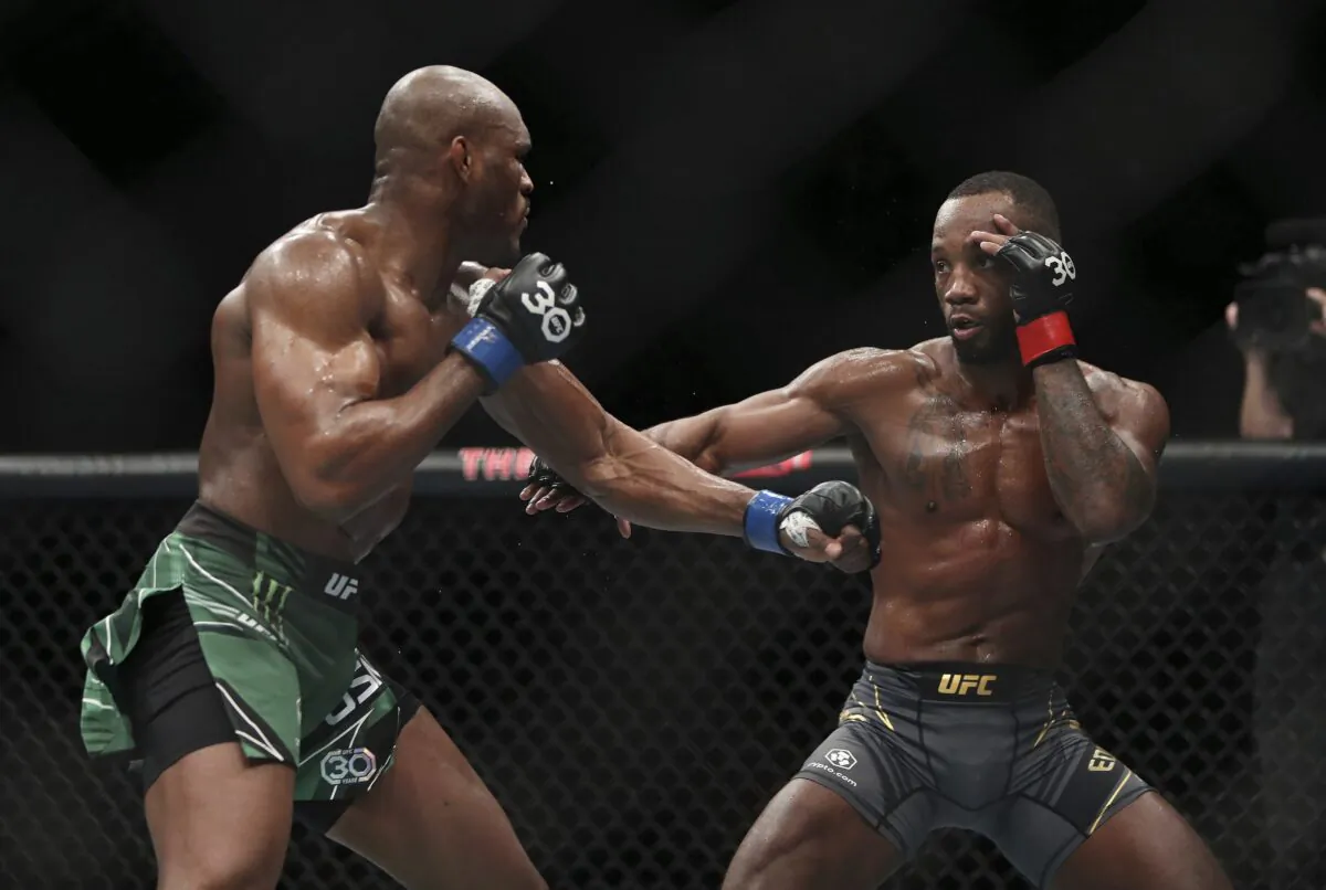 Leon Edwards (R) faces off against Kamaru Usman during their welterweight title bout at the UFC 286 mixed martial arts event Saturday in London on March 18, 2023. (Kieran Cleeves/PA via AP)