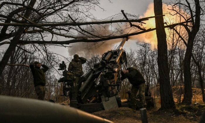 Ukrainian servicemen fire an M777 howitzer at Russian positions near Bakhmut, eastern Ukraine, on March 17, 2023, amid the Russian invasion of Ukraine. (Aris Messinis/AFP via Getty Images)