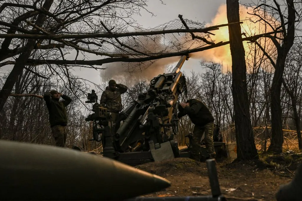 Ukrainian servicemen fire an M777 howitzer at Russian positions near Bakhmut, eastern Ukraine, on March 17, 2023, amid the Russian invasion of Ukraine. (Aris Messinis/AFP via Getty Images)