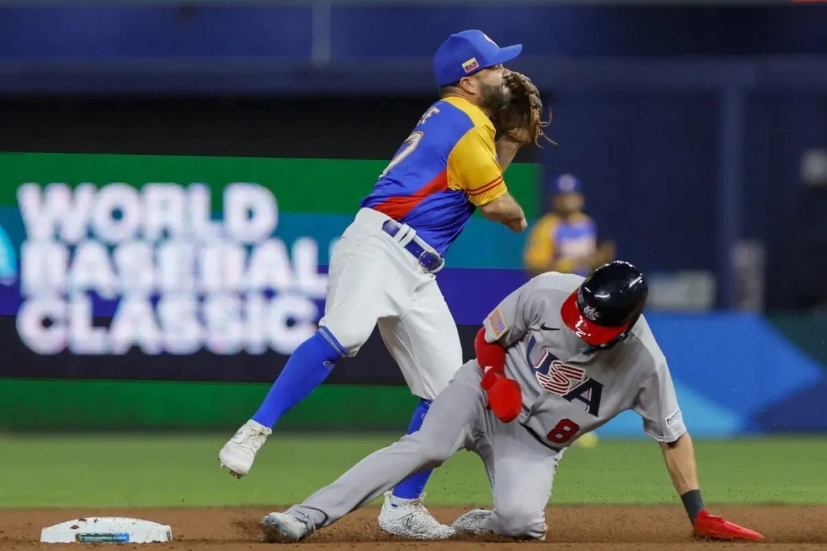 Venezuela second baseman Jose Altuve (27) turns a double play over USA shortstop Trea Turner (8) during the second inning at LoanDepot Park in Miami on March 18, 2023. (Sam Navarro-USA TODAY Sports via Field Level Media)