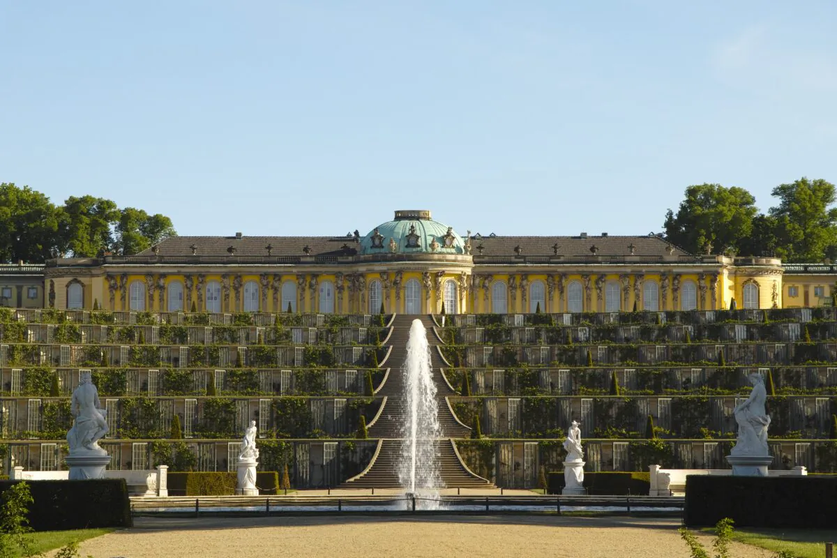 The garden side of Sanssouci is the most famous view of the palace, with its six-fold sweep of the staircase. The one-story level façade on the upper plateau of a vineyard provides the perfect stage for the Rococo lifestyle, close to nature. The structure stands apart from multi-level extravagant Baroque palaces that act as a representation of power.  (With permission © SPSG / Hans Bach)