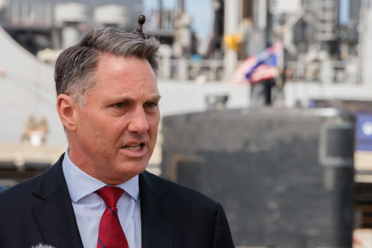 Defence Minister Richard Marles speaks at a press conference in front of the USS Asheville, a Los Angeles-class nuclear powered fast attack submarine during a tour of HMAS Stirling in Perth, Australia, on March 16, 2023. (AAP Image/Richard Wainwright)