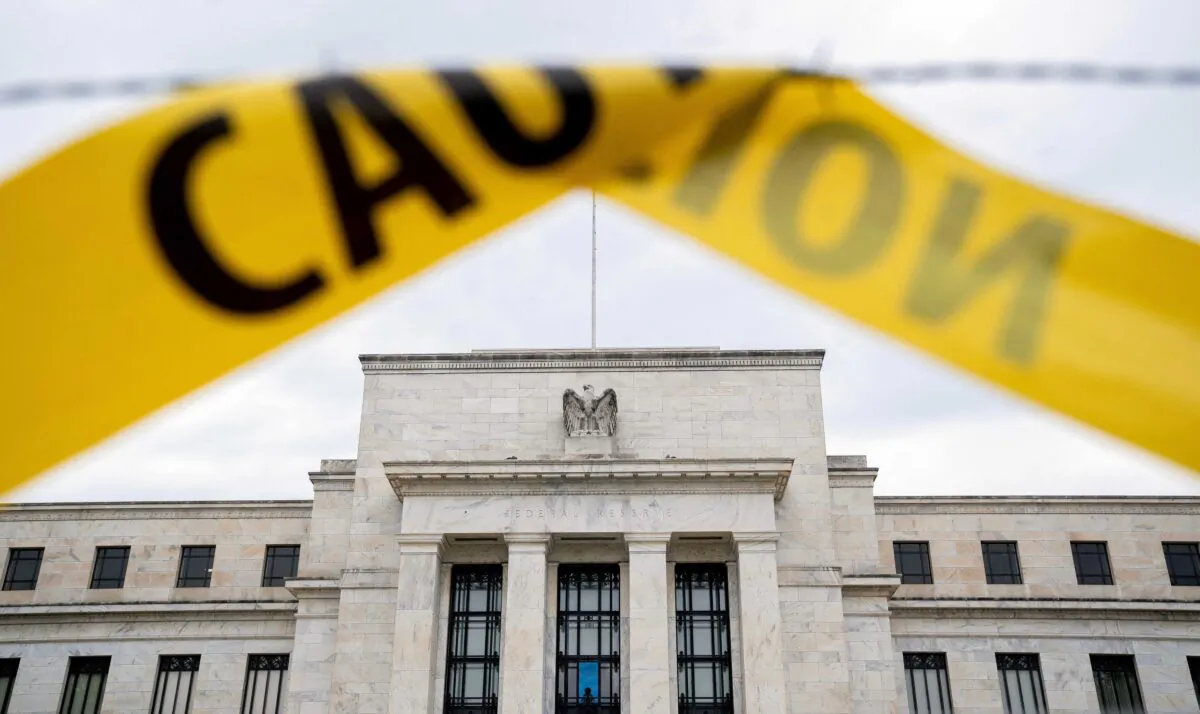 The U.S. Federal Reserve building is seen past caution tape in Washington on Sept. 19, 2022. (Stefani Reynolds/AFP via Getty Images)