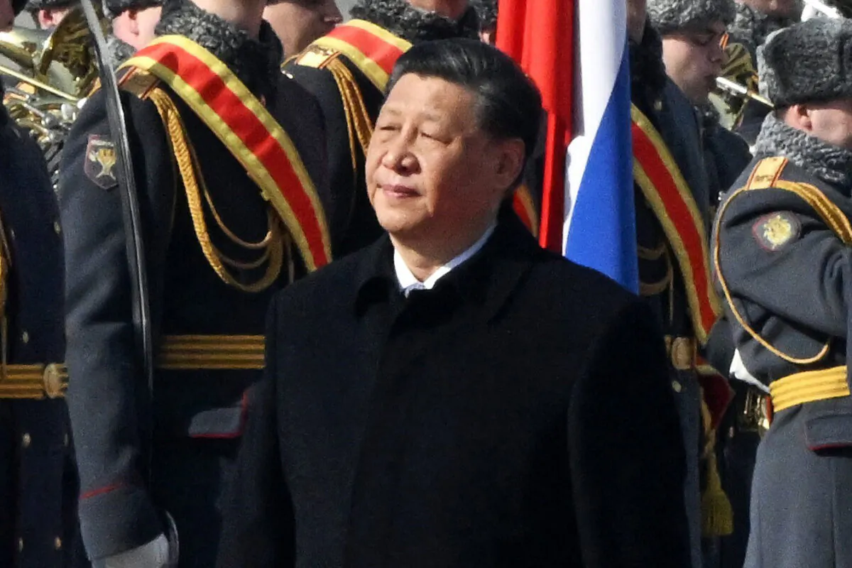 Chinese leader Xi Jinping walks past honour guards during a welcoming ceremony at Moscow's Vnukovo airport on March 20, 2023. (Anatoliy Zhdanov/Kommersant Photo/AFP via Getty Images)