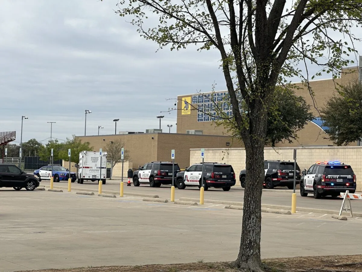 Police respond to a shooting that left one student dead, and another student injured at Lamar High School in Arlington, Texas, on March 20, 2023. (Jana Pruet/The Epoch Times)