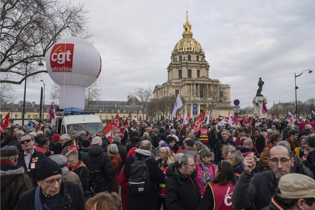 People stage a protest against the retirement bill in Paris on March 20, 2023. (Lewis Joly/AP Photo)