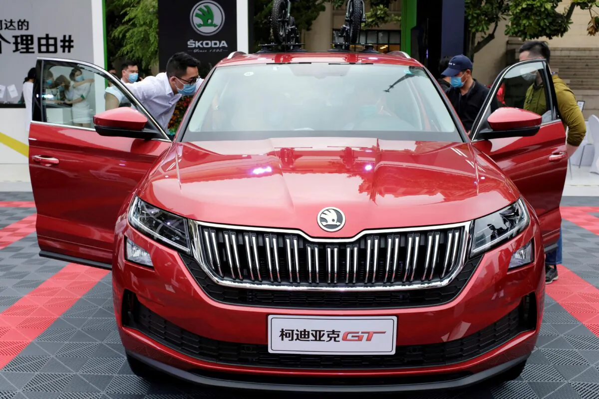 Visitors check a Skoda vehicle at a sales event in Shanghai on May 5, 2020. (Yilei Sun/Reuters)