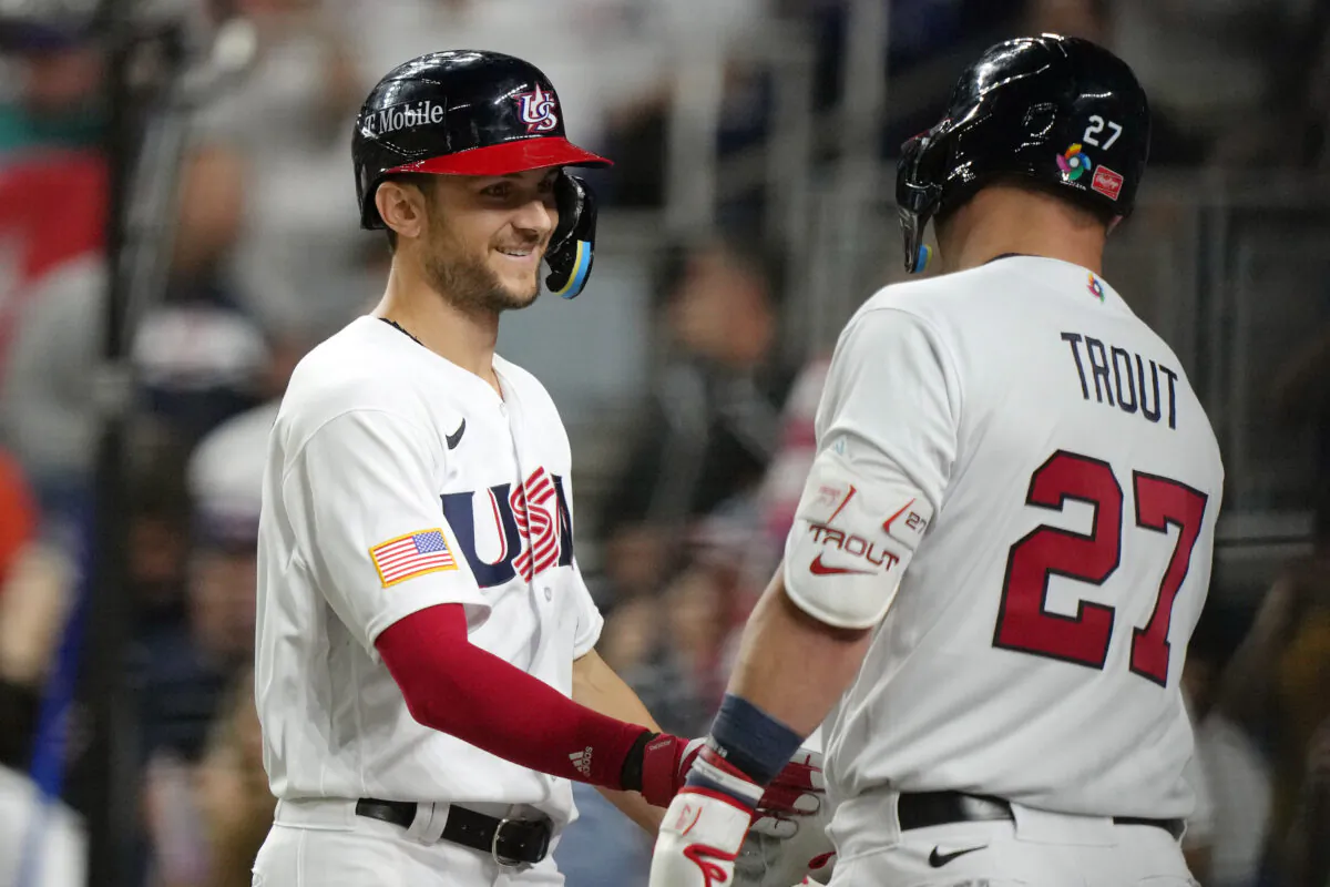 Trea Turner (8) of Team USA celebrates with Mike Trout (27) after hitting a three-run home run in the sixth inning against Team Cuba during the World Baseball Classic Semifinals at loanDepot park in Miami on March 19, 2023. (Eric Espada/Getty Images)