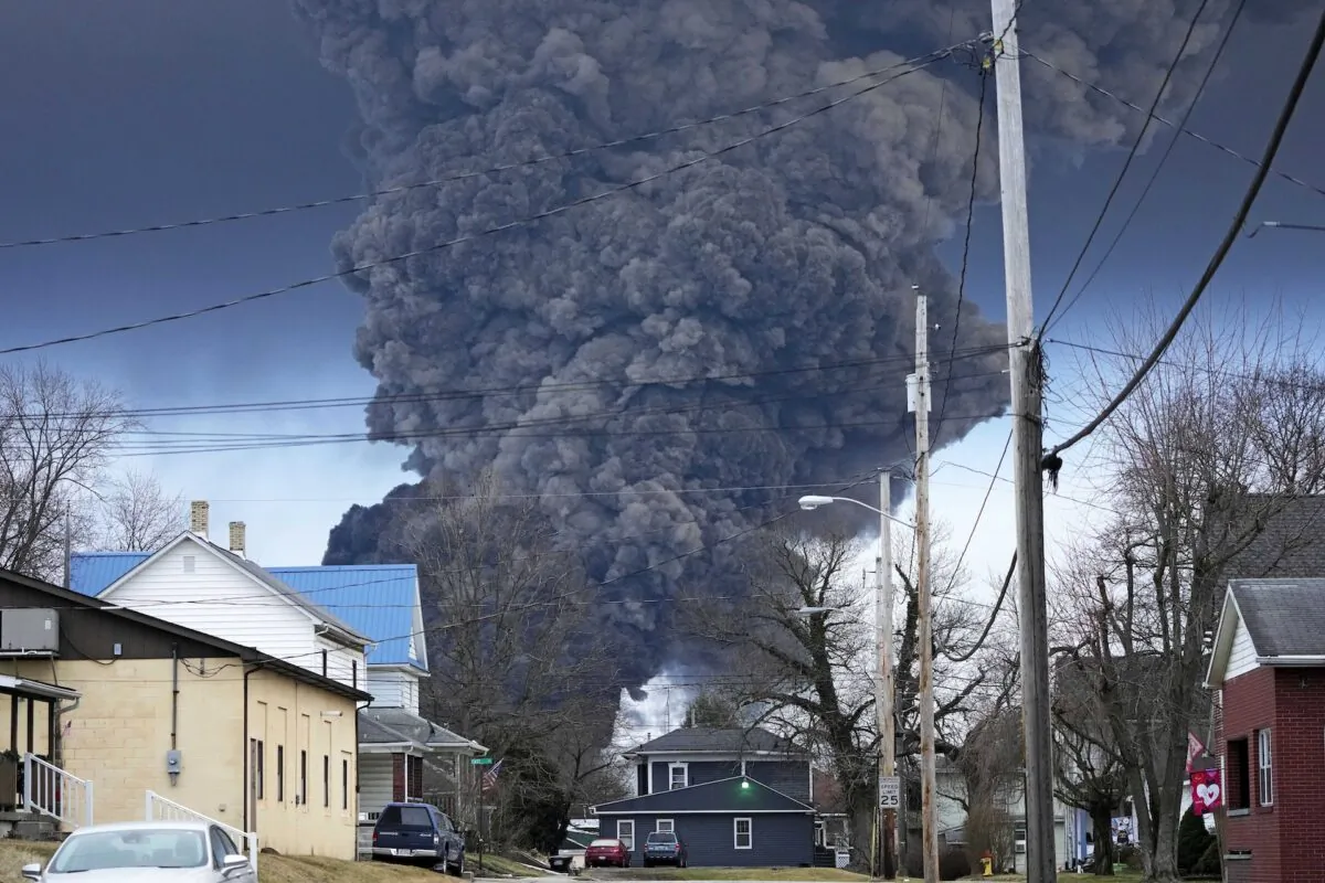 A black plume rises over East Palestine, Ohio, as a result of a controlled detonation of a portion of the derailed Norfolk Southern trains, on Feb. 6, 2023. (Gene J. Puskar/AP Photo/File)