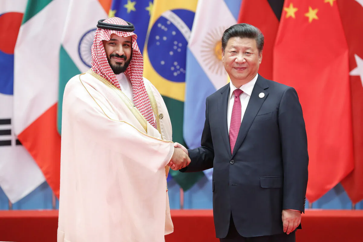 Chinese leader Xi Jinping (R) shakes hands with then Saudi Arabian Deputy Crown Prince and Minister of Defense Mohammed bin Salman at the G20 Summit in Hangzhou, China, on Sept. 4, 2016. (Lintao Zhang/Getty Images)