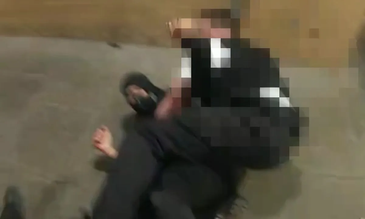 A still from a police body-worn camera of Sulai Man, who was armed with a knife, being tackled by a police officer in a block of flats in Wood Green, north London, on Aug. 6, 2021. (Metropolitan Police)