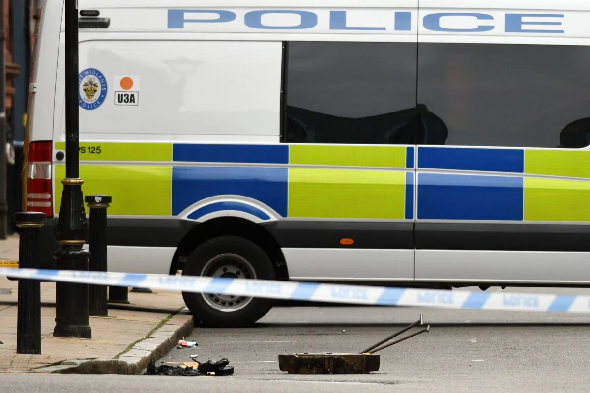 A opened drain cover lies in the road near to a cordon on Edmund Street following a major stabbing incident in the center of Birmingham, central England, on Sept. 6, 2020. (Oli Scarff/AFP via Getty Images)