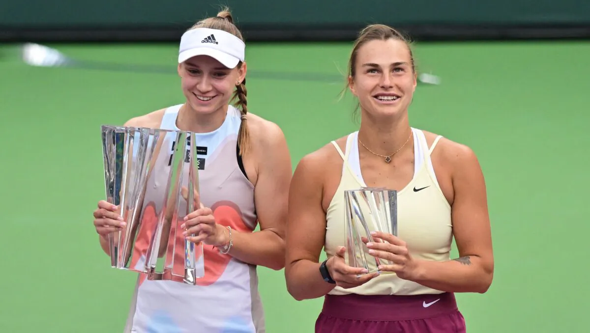 Elena Rybakina of Kazakhstan (L) and Aryna Sabalenka of Belarus pose with their respective trophies following their Finals match at the 2023 WTA Indian Wells Open on March 19, 2023. (Frederic J. Brown/AFP via Getty Images)