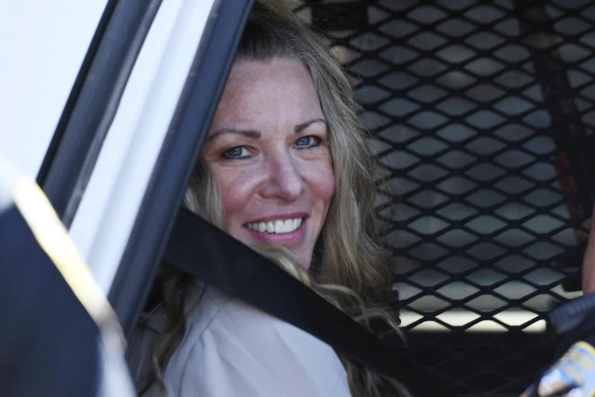 Lori Vallow Daybell sits in a police car after a hearing at the Fremont County Courthouse in St. Anthony, Idaho, on Aug. 16, 2022. (Tony Blakeslee/East Idaho News via AP, Pool)