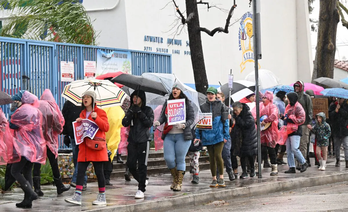Los Angeles public school workers, teachers, and supporters walk the picket line in front of an elementary school in Los Angeles on March 21, 2023. (Robyn Beck/AFP via Getty Images)