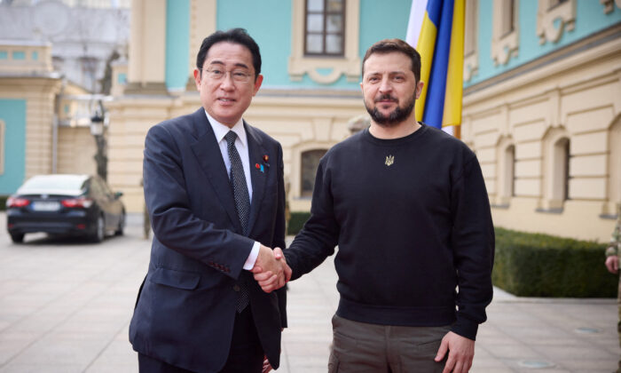 Ukraine's President Volodymyr Zelenskyy and Japan Prime Minister Fumio Kishida (L) shake hands as they meet in Kyiv, Ukraine, on March 21, 2023. (Ukrainian Presidential Press Service/Handout via Reuters)