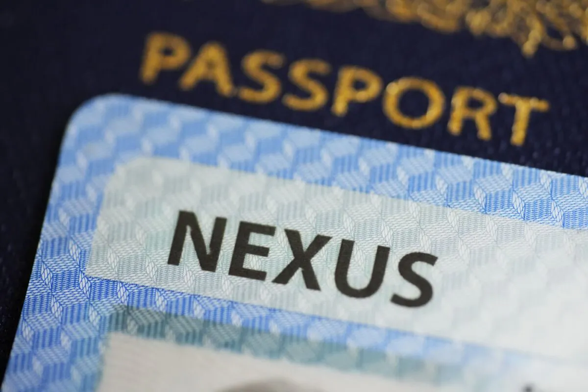 A NEXUS card and a Canadian passport are pictured in Ottawa on Jan. 17, 2023. (The Canadian Press/Sean Kilpatrick)