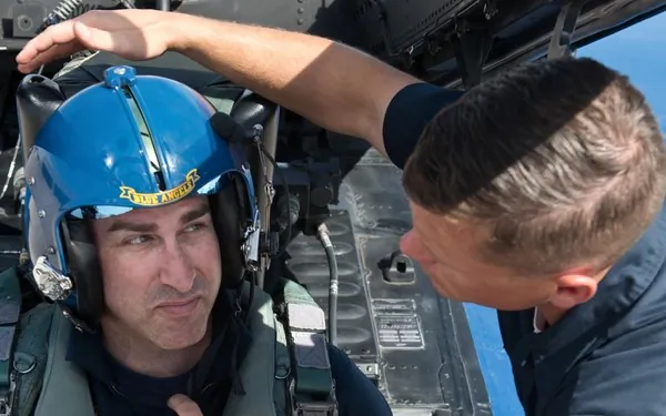 Comedian and Marine Lt. Col. Rob Riggle receives a back-seat ride in a U.S. Navy flight demonstration squadron, the Blue Angels F/A-18 Hornet at Naval Air Facility El Centro, Calif., on March 11, 2014. Riggle and the Funny or Die film crew spent the day touring the squadron and filming a Funny or Die segment. (U.S. Navy photo by Mass Communication Specialist 2nd Class Kathryn E. Macdonald/Released)