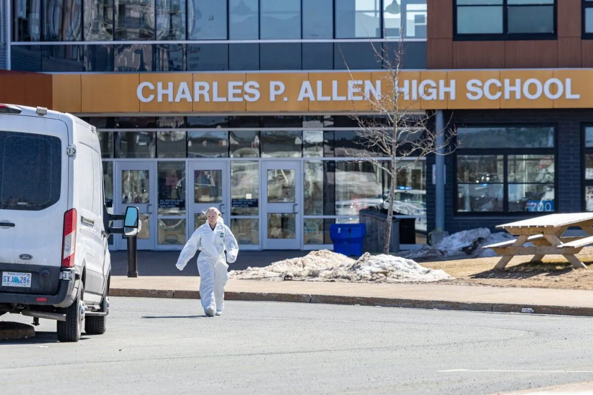 Forensics on the scene at Charles P. Allen High School in Halifax, Mar. 20, 2023. (The Canadian Press/Riley Smith)
