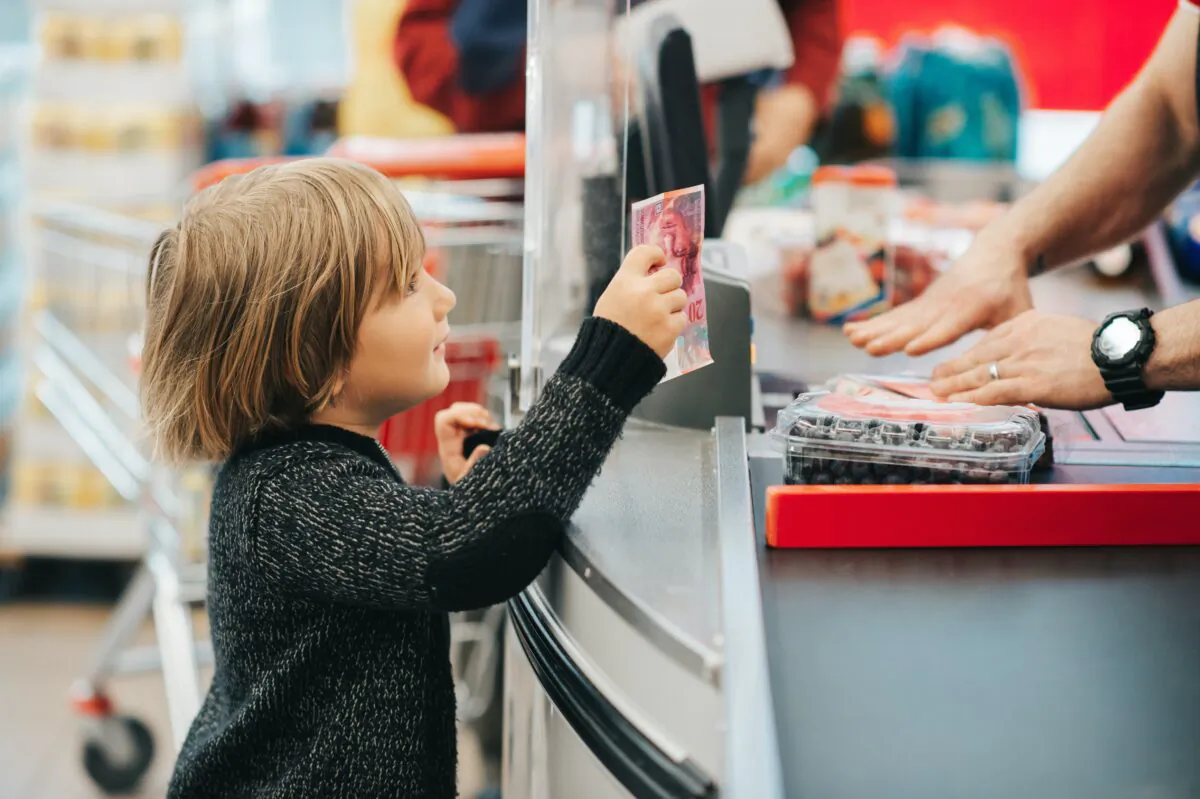 Having their own money teaches kids about responsibility, consequences, saving, and charity, says Mary Hunt. (Anna Nahabed/Shutterstock)