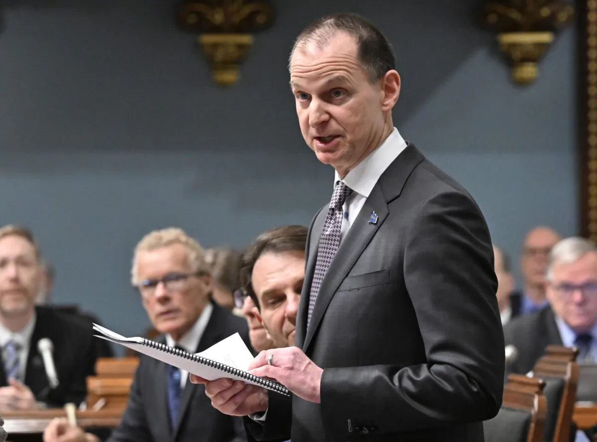 Quebec Finance Minister Eric Girard reads his budget speech in the Quebec legislature in Quebec City on March 21, 2023. (The Canadian Press/Jacques Boissinot)