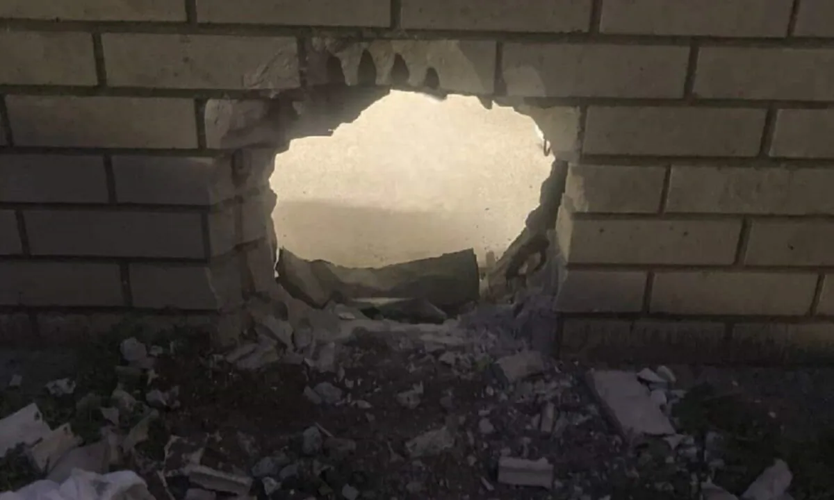 A hole in the wall of a prison cell in Newport News, Va., on March 20, 2023. (Newport News Sheriff's Office via AP)