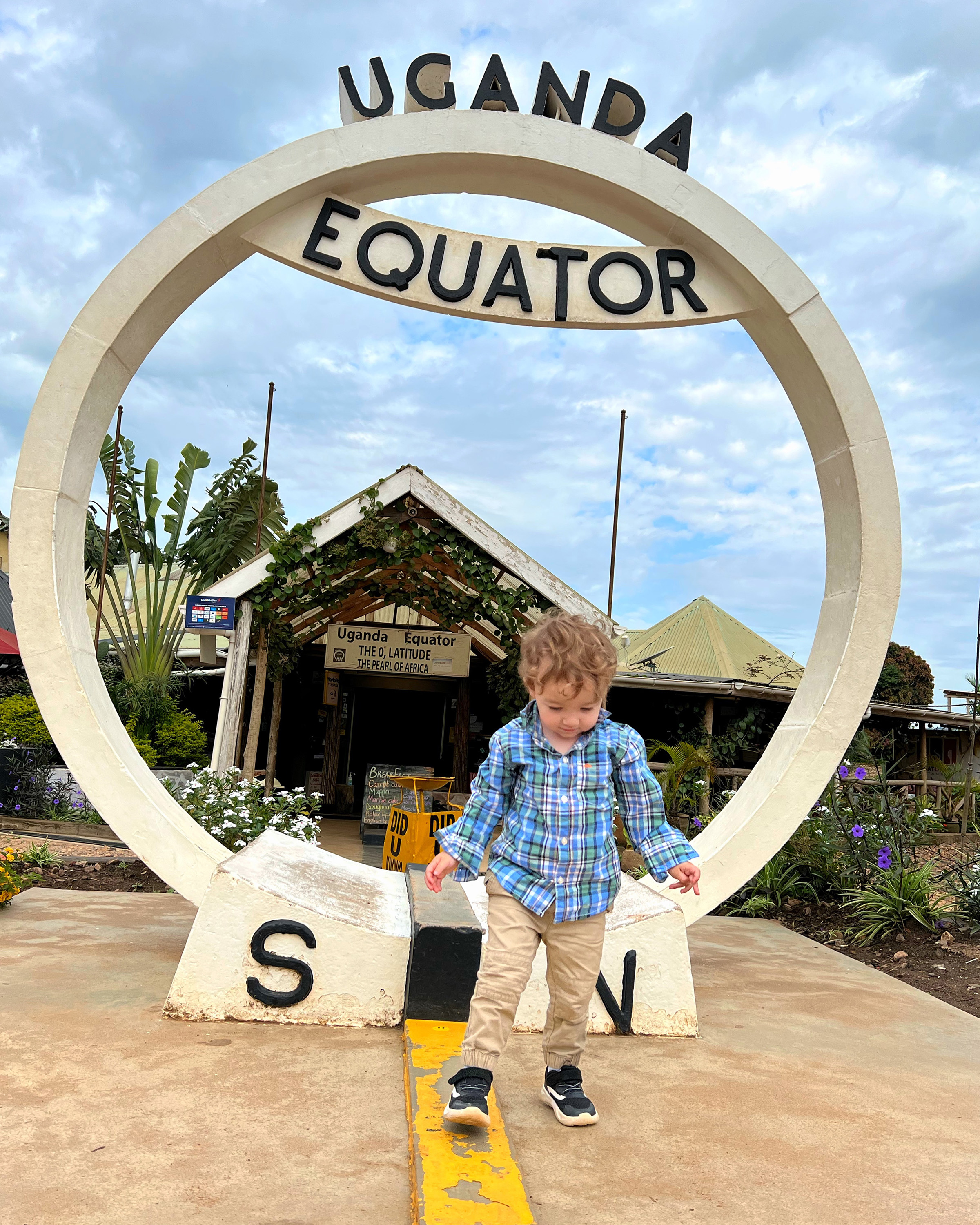 Max Smith, 2, walks on the equator in Uganda in October 2022.