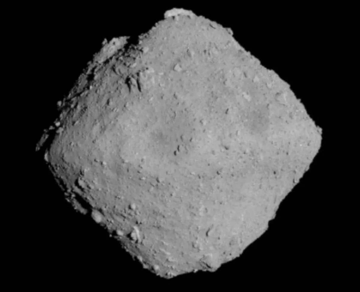 The carbonaceous asteroid Ryugu is seen from a distance of about 12 miles (20 km) during the Japanese Space Agency's Hayabusa2 mission on June 30, 2018. (JAXA, University of Tokyo, Kochi University, Rikkyo University, Nagoya University, Chiba Institute of Technology, Meiji University, University of Aizu and AIST/Handout via Reuters)
