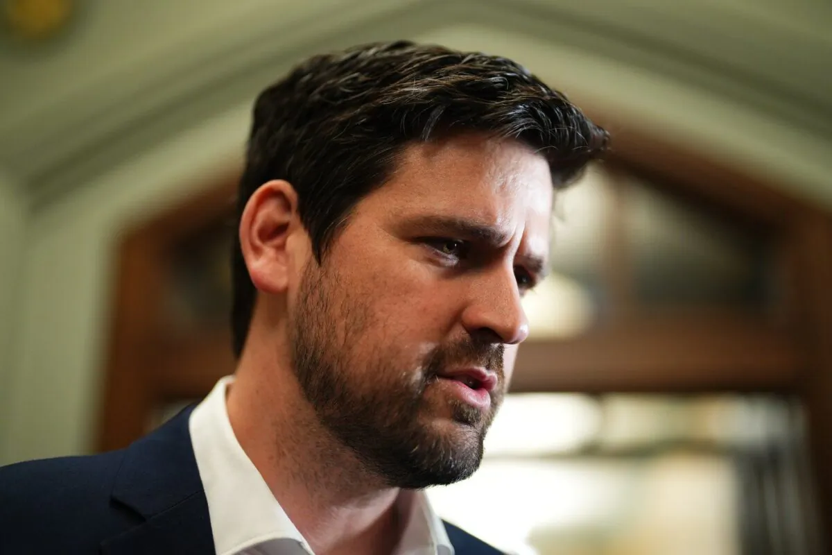Sean Fraser, Minister of Immigration, Refugees and Citizenship, arrives to a caucus meeting on Parliament Hill in Ottawa on Mar. 22, 2023. (The Canadian Press/Sean Kilpatrick)