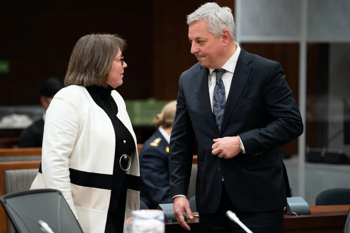 Then-Commissioner of the RCMP Brenda Lucki speaks with Director of the Canadian Security Intelligence Service (CSIS), David Vigneault as they wait to appear befoer a House of Commons committee in Ottawa on Feb. 6, 2023. (The Canadian Press/Spencer Colby)