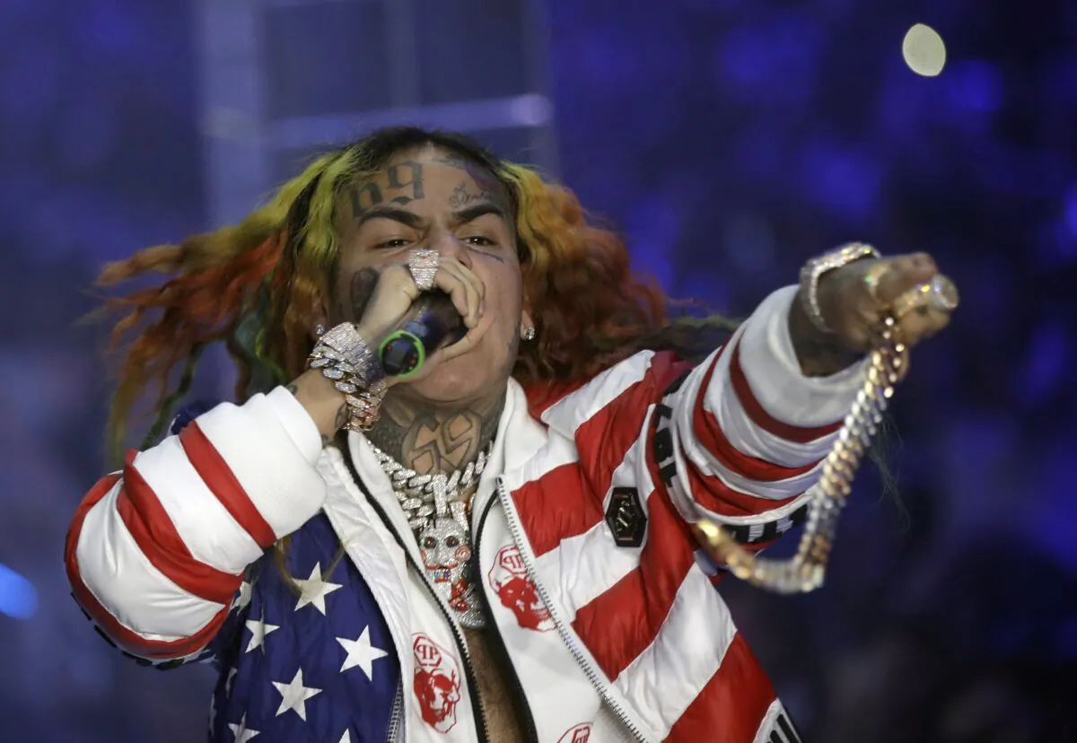 Rapper Daniel Hernandez, known as Tekashi 6ix9ine, performs during the Philipp Plein Women's 2019 Spring-Summer Collection, unveiled during Fashion Week in Milan on Sept. 21, 2018. (Luca Bruno/AP Photo)