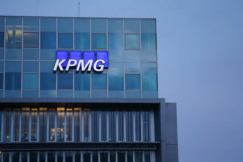 The logo of KPMG, a multinational tax advisory and accounting services company, hangs on a building in Berlin, Germany, on Jan. 22, 2021. (Sean Gallup/Getty Images)