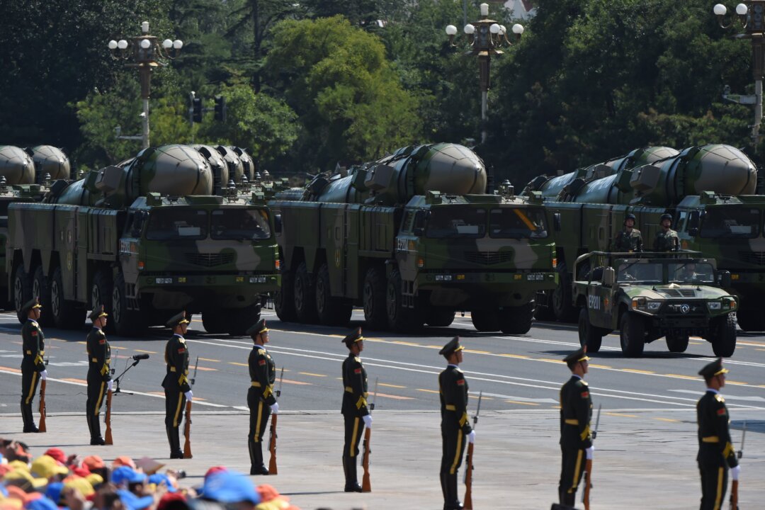 Military vehicles carrying DF-21D intermediate-range anti-ship ballistic missiles participate in a military parade at Tiananmen Square in Beijing on Sept. 3, 2015. (Greg Baker/AFP via Getty Images)