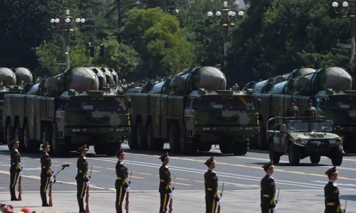Military vehicles carrying DF-21D intermediate-range anti-ship ballistic missiles participate in a military parade at Tiananmen Square in Beijing on September 3, 2015, to mark the 70th anniversary of victory over Japan and the end of World War II. China kicked off a huge military ceremony marking the 70th anniversary of Japan's defeat in World War II on September 3, as major Western leaders stayed away. (GREG BAKER/AFP via Getty Images)
