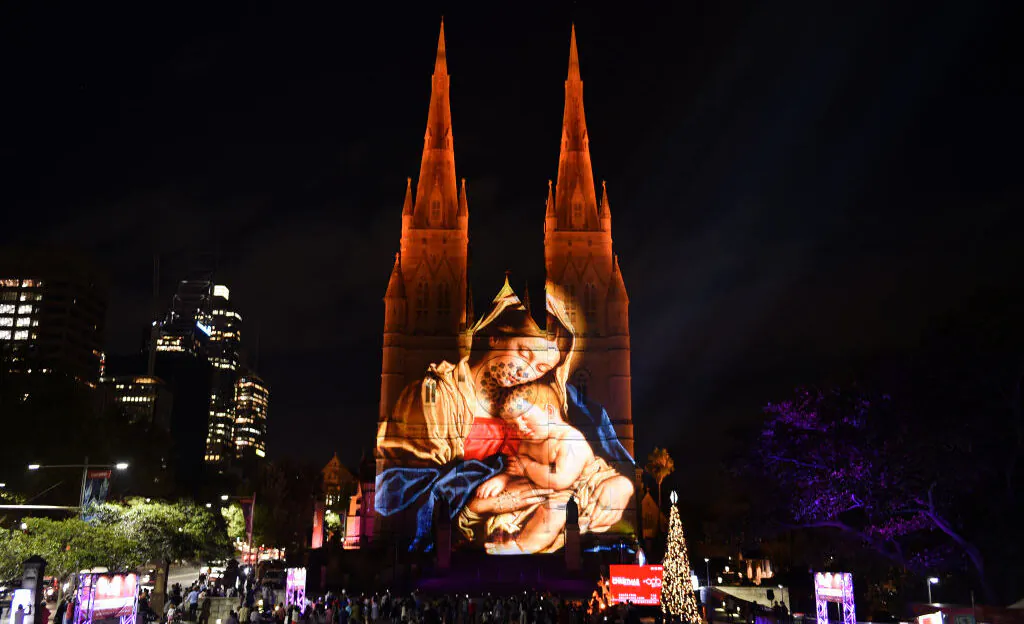 St Mary's Cathedral is illuminated with a Christmas-themed projection in Sydney to celebrate the Christmas season in Australia on Dec. 9, 2016. (Saeed Khan/AFP via Getty Images)