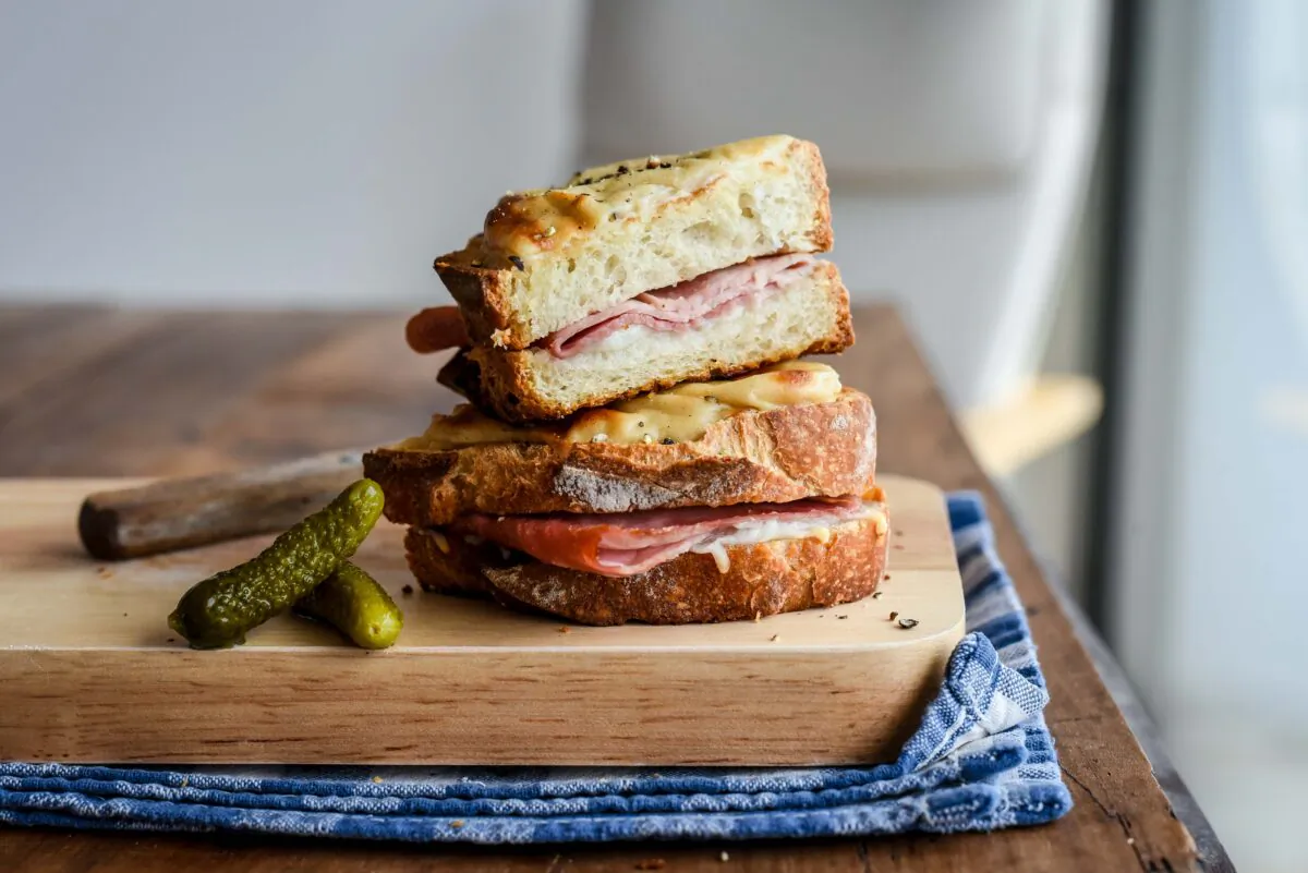 The “croque monsieur” is filled with Paris ham and French hard mountain cheese, grilled to perfection, then covered with a creamy béchamel sauce and finished under the broiler. (Audrey Le Goff)