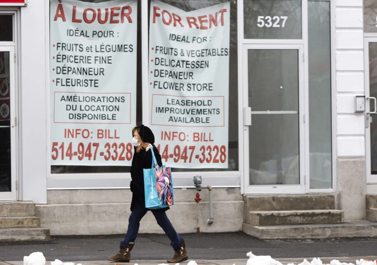 A pedestrian walks past a vacant storefront as the COVID-19 pandemic continues to impact small businesses in Montreal on Nov. 23, 2020. (The Canadian Press/Ryan Remiorz)