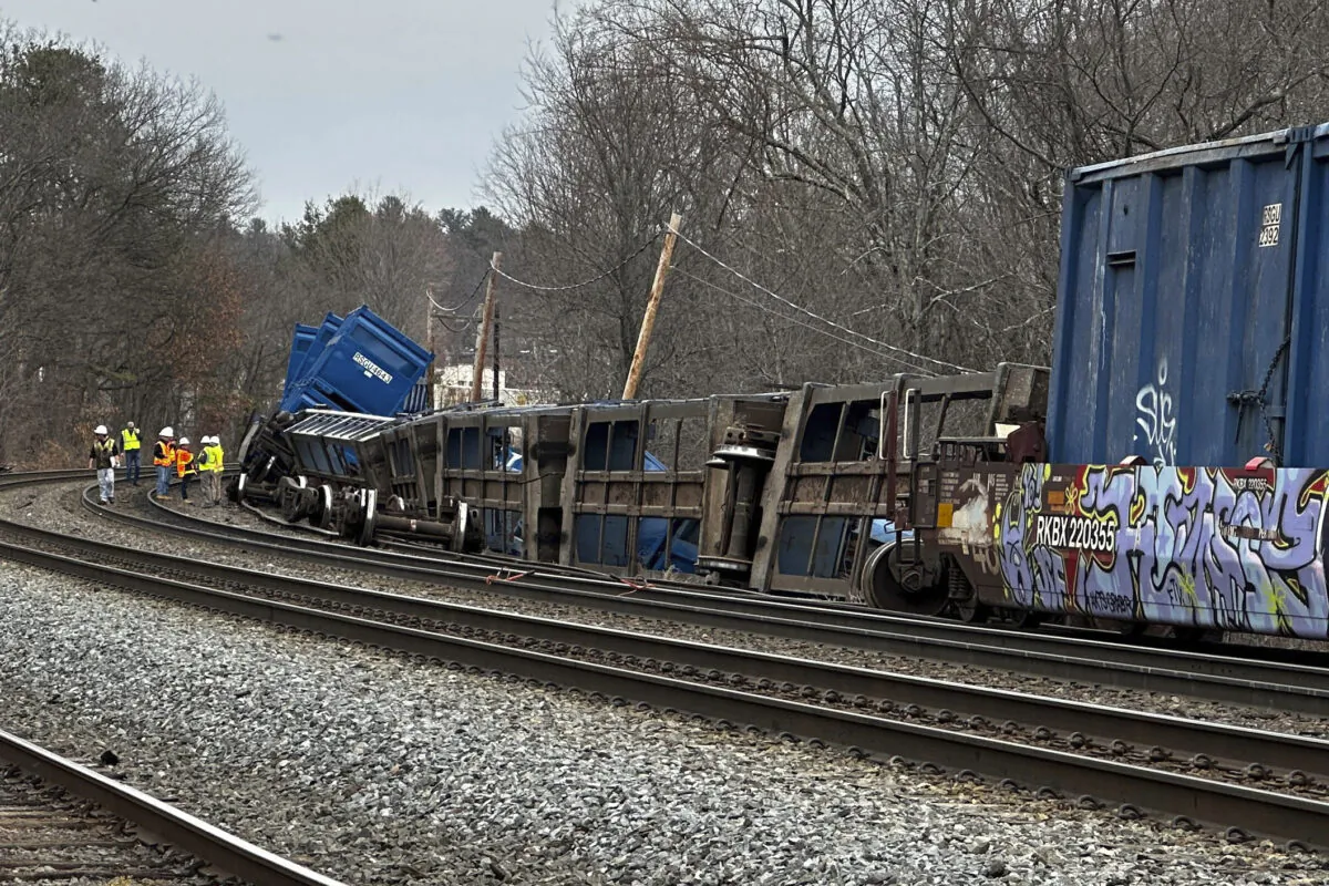 Officials work at the scene of a freight train derailment in Ayer, Mass., on March 23, 2023. (Rodrique Ngowi/AP Photo)