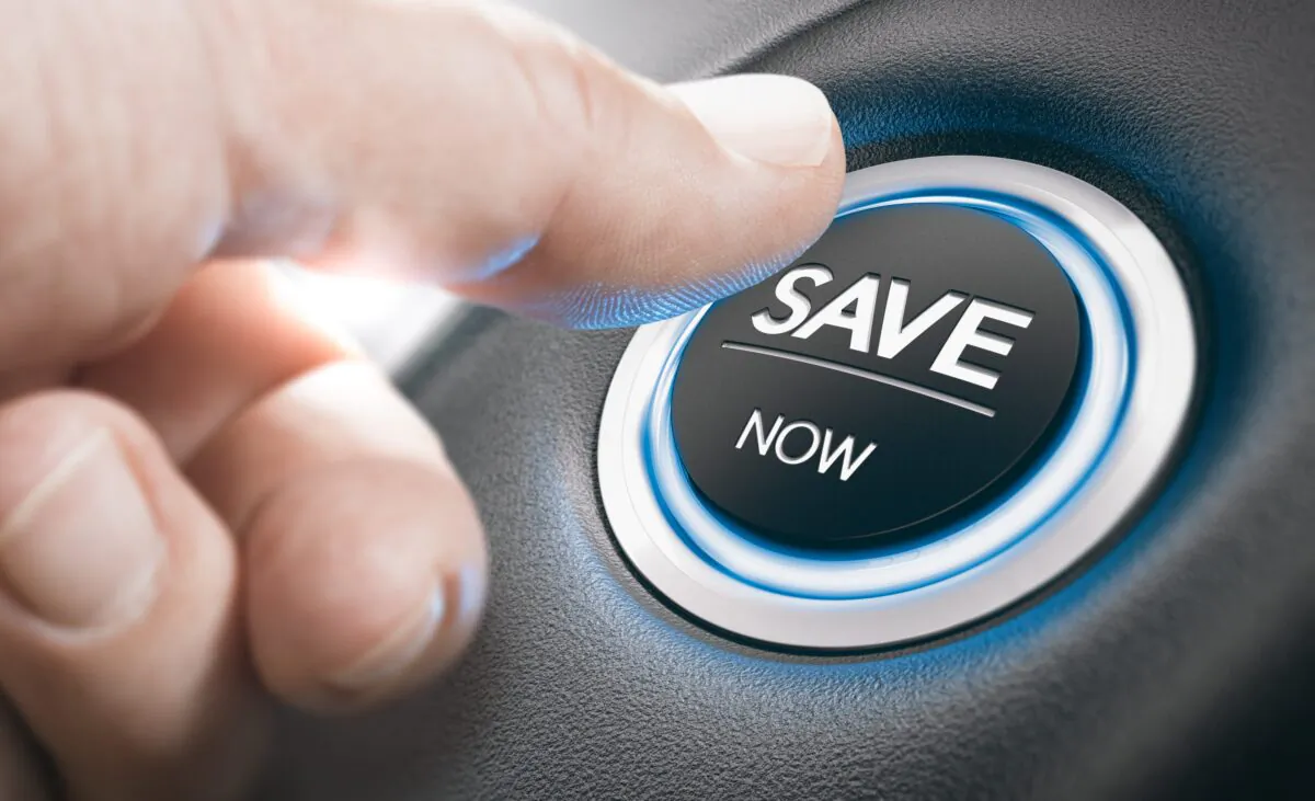 Man pushing a start button with the text save now. Concept of car offers or discount. Composite image between a finger photography and a 3D background. (Shutterstock)