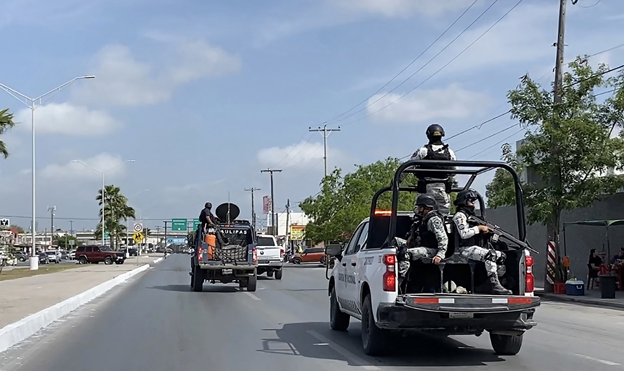 National Guard and military vehicles take part in an operation to transfer two of the four U.S. citizens kidnapped in Mexico back to Brownsville, Texas, after the other two were found dead, in Matamoros, Mexico, on March 7, 2023.